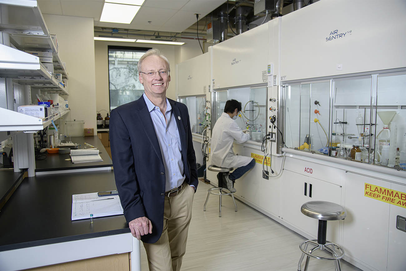 Dean Rick G. Schnellmann, PhD, stands in a chemistry laboratory in the Skaggs building in February 2020.